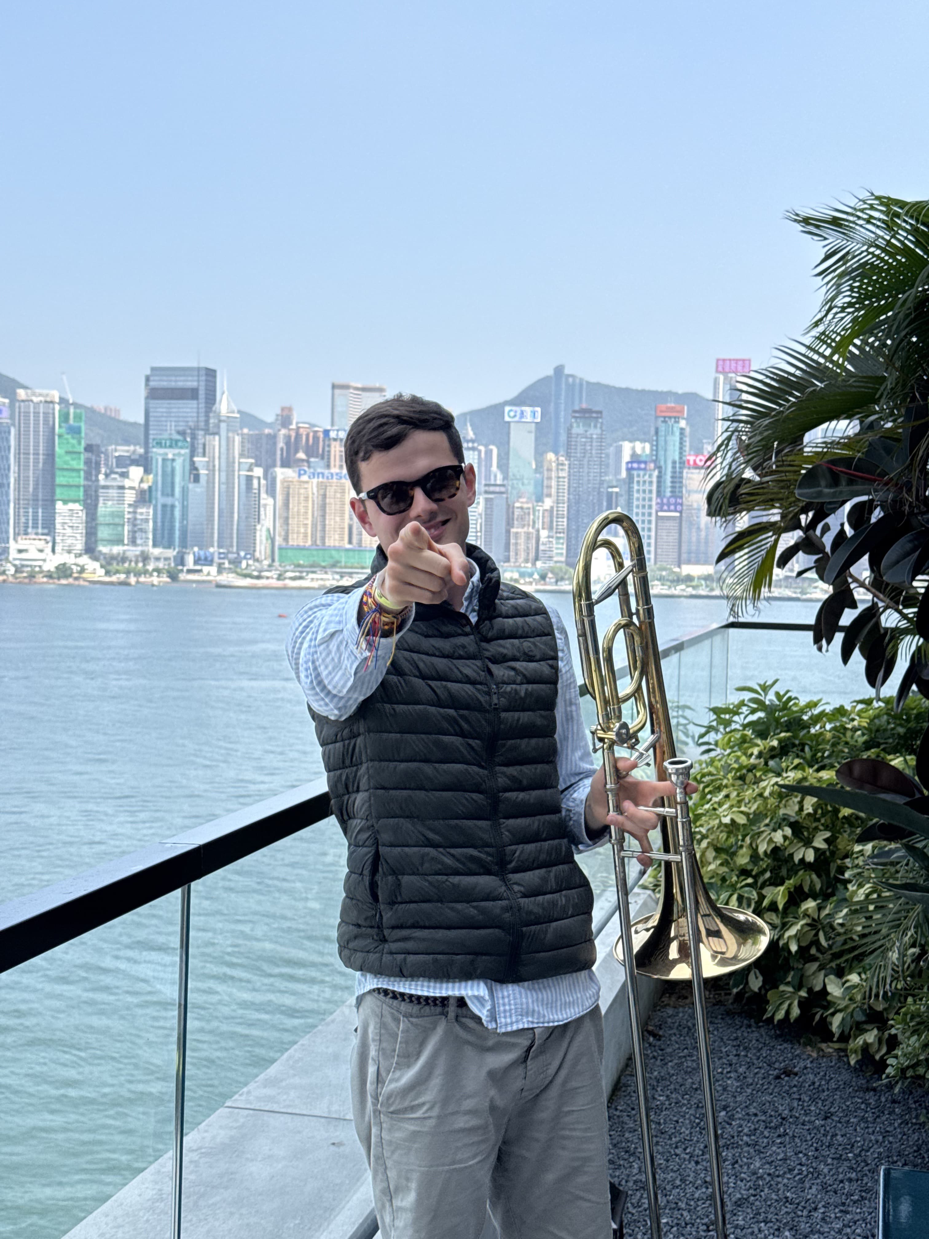 Victor Alegría with trombone, Hong Kong